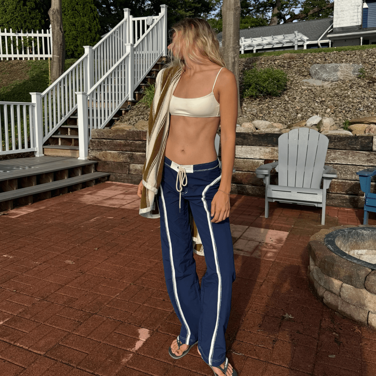 The Unexpected Pant Trend Cool Girls Are Wearing With Bikinis, Tanks, and Flip-Flops