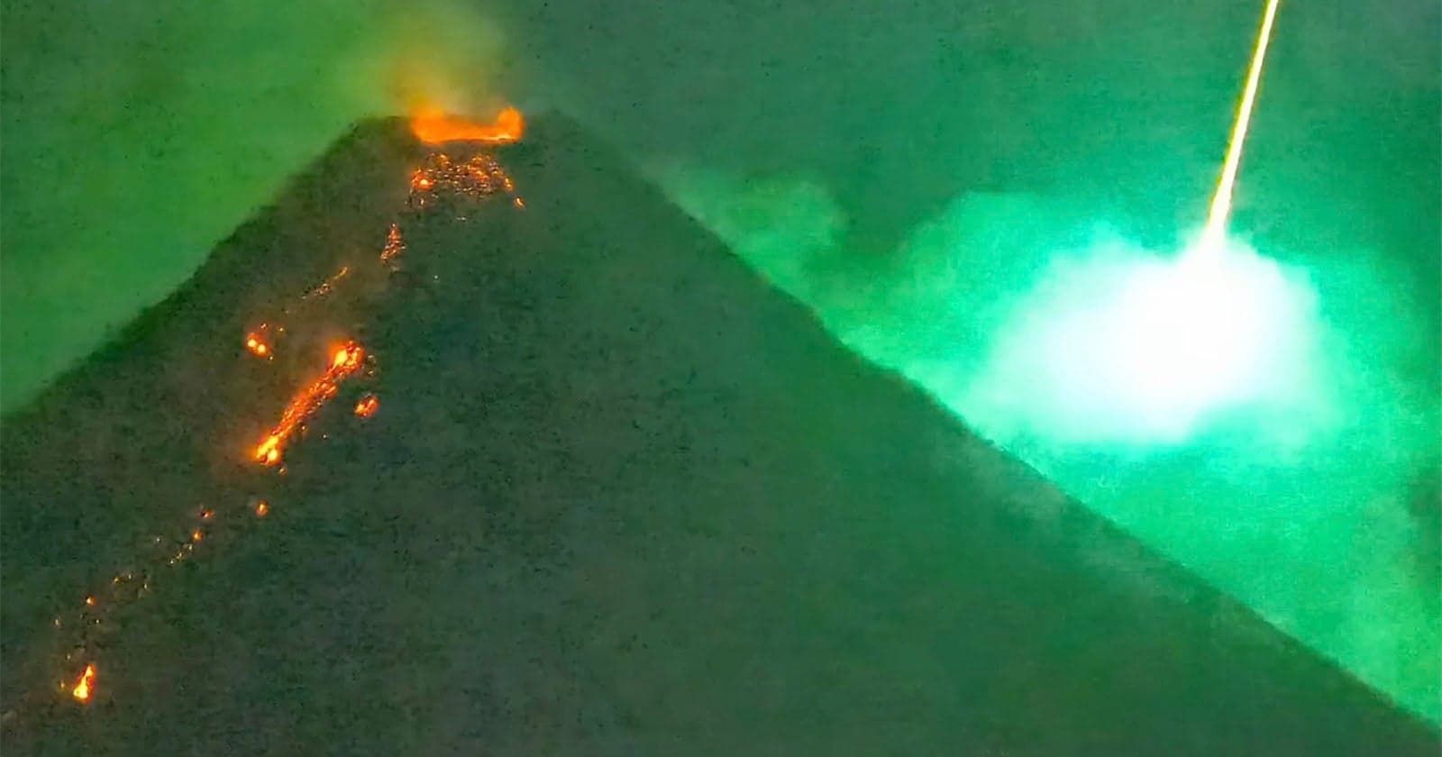 Spectacular Moment Meteor Explodes Behind Erupting Volcano Caught on Camera