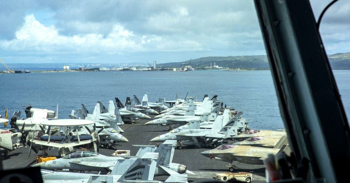 U.S. Carrier Strike Group Resupplies in Guam After Ten-Month Deployment